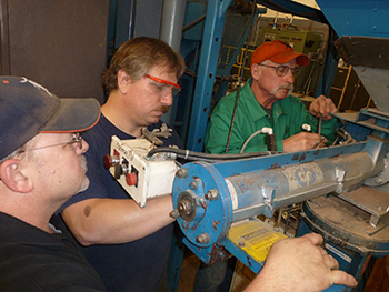 (Left to right) Don Crowley, Tomy Wortelboer, and Mark Houston mainatin the no-bake sand mixer after making the award-winning casting.